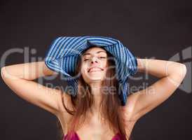 Cheerful pretty young girl with smiling face in cap