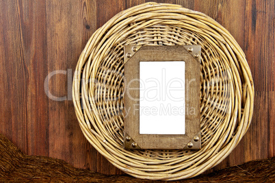 Wooden frame on round woven wicker background