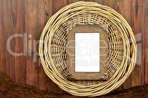 Wooden frame on round woven wicker background