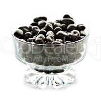 Bowl of chocolate coated cranberries or raisins