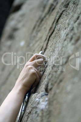 Climbers hand and quick-draws