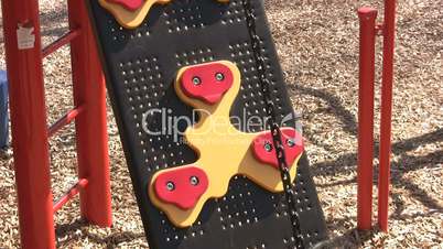 Little Girl Climbing At The Playground