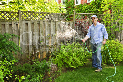 Man watering garden