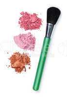 Crushed cosmetics with makeup brush