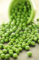 Spilled bowl of green peas