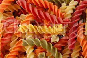 multi colored twirls pasta background