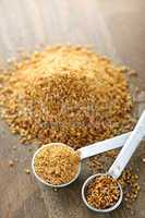 Coconut palm sugar in measuring spoons