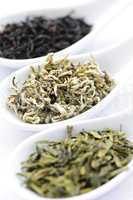 Assortment of dry tea leaves in spoons