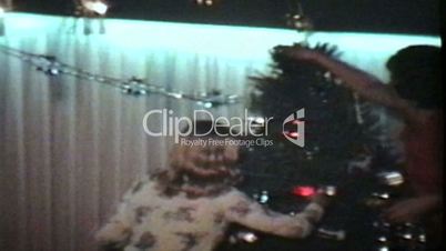 Putting Presents Under Christmas Tree (1978 Vintage 8mm film)