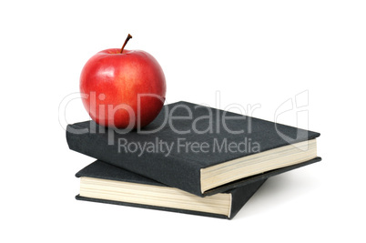 red apple on a book