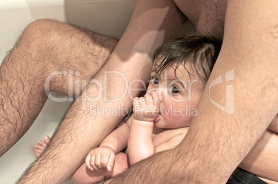 Father making Bath with his Daughter in the Bathtub