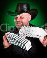 man skilfully shuffles playing cards