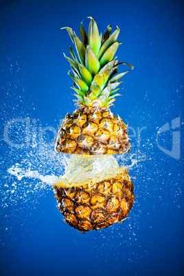 Pineapple splashed with water