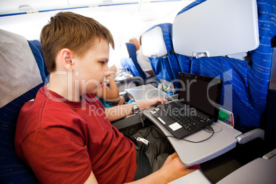 boy flies in the plane