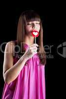 young woman lick candy with desire