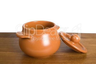 Ceramic pot on the wooden board