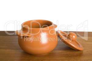 Ceramic pot on the wooden board