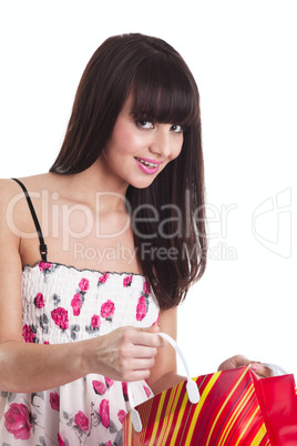 Young girl with present bag look at you