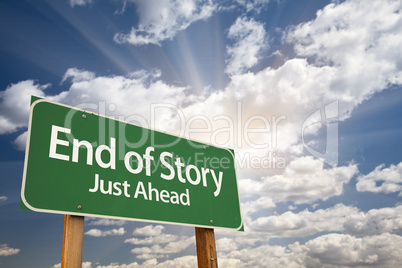 End of Story Green Road Sign and Clouds