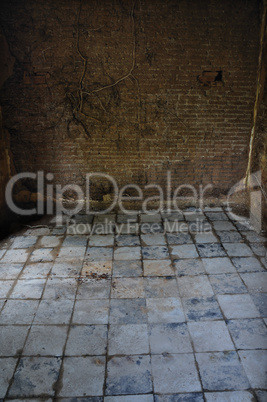 dirty tiled floor and brick wall empty room
