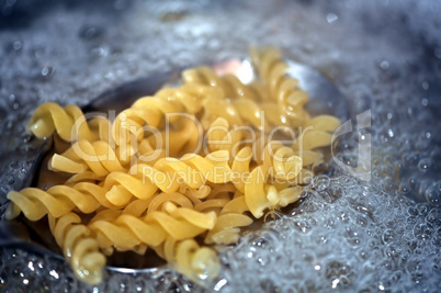 fusilli pasta in boiling water