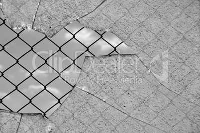 broken glass and wired fence