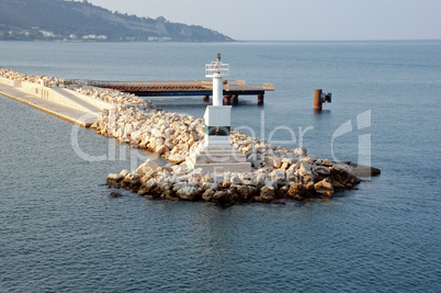 lighthouse and rock jetty breakwater