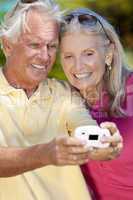 Happy Senior Couple Taking Self Portrait Photograph with Digital