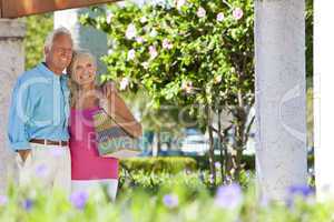 Happy Senior Couple Smiling Outside in Sunshine