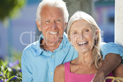 Happy Senior Couple Smiling Outside in Sunshine