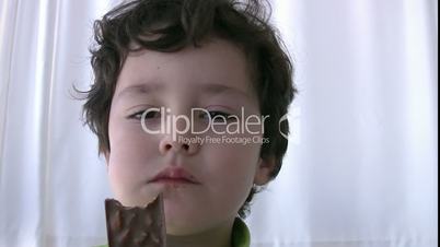 little boy eating chocolate
