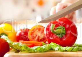 Woman's hands cutting vegetables