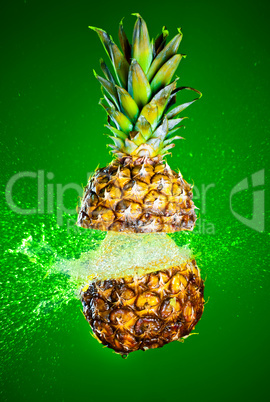 Pineapple splashed with water