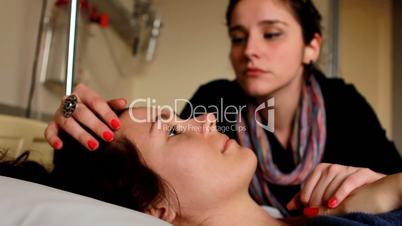 woman chucking a patient's cheek