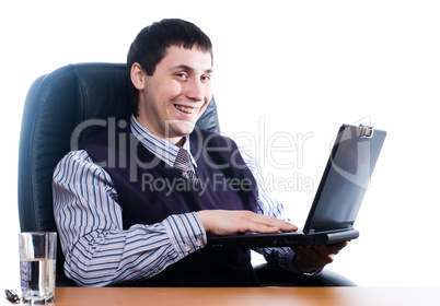 Portrait of a young businessman with laptop