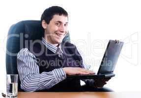 Portrait of a young businessman with laptop