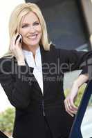Blond Businesswoman Talking On Her Cell Phone