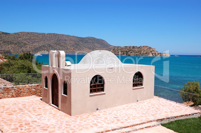 New building probably Orthodox Church and Spinalonga island at b