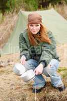 Camping woman tent washing dishes nature