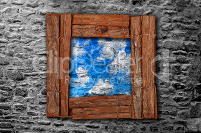 Grunge wooden frame on old stonewall with blue sky graffiti
