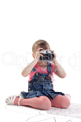 Child with old-style film photo camera