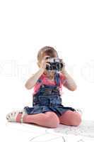 Child with old-style film photo camera