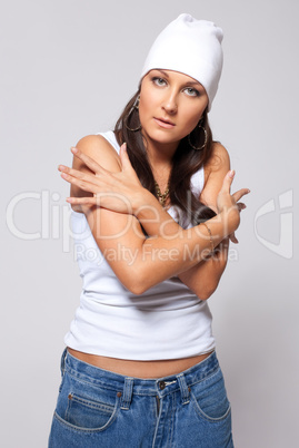 Young beauty girl in hat and jeans - tomboy style