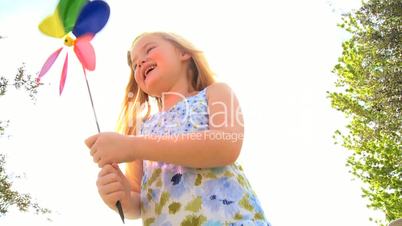 Cute Little Girl With Toy Windmill