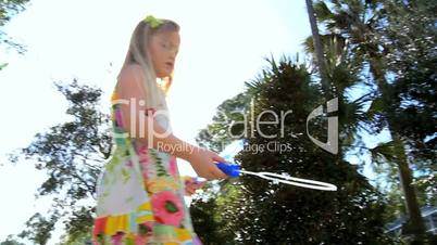 Cute Little Girl with Soap Bubbles