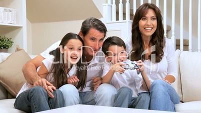 Family Enjoying Games Console