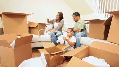 African-American Family Unpacking in New Home