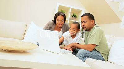 African American Family Sharing a Laptop