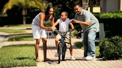 Young Ethnic Boy Practicing Bicycle Riding
