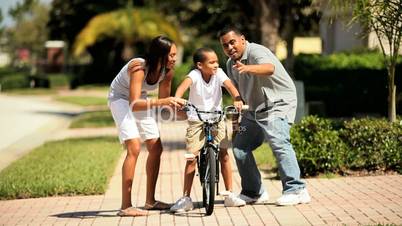 Young Boy Learning to Ride Bicycle